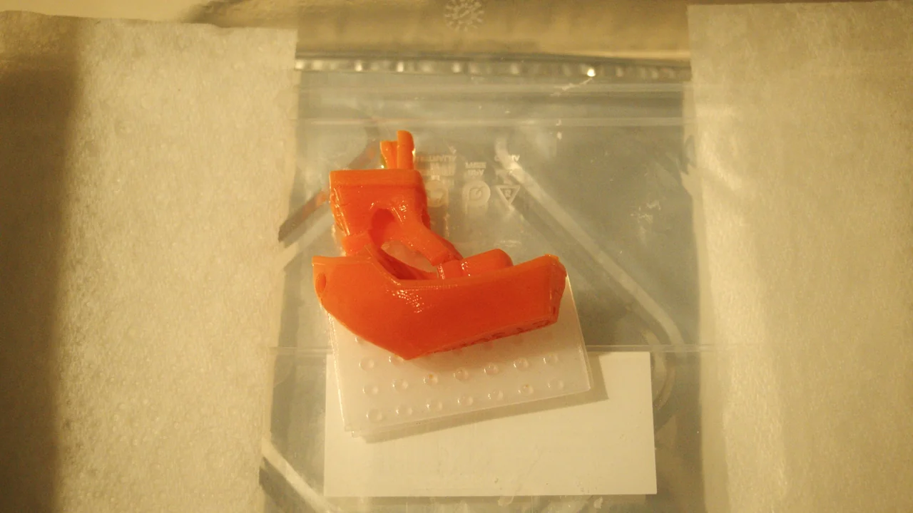 Benchy after 24 hours of acetone vapour exposure — completely collapsed and deformed